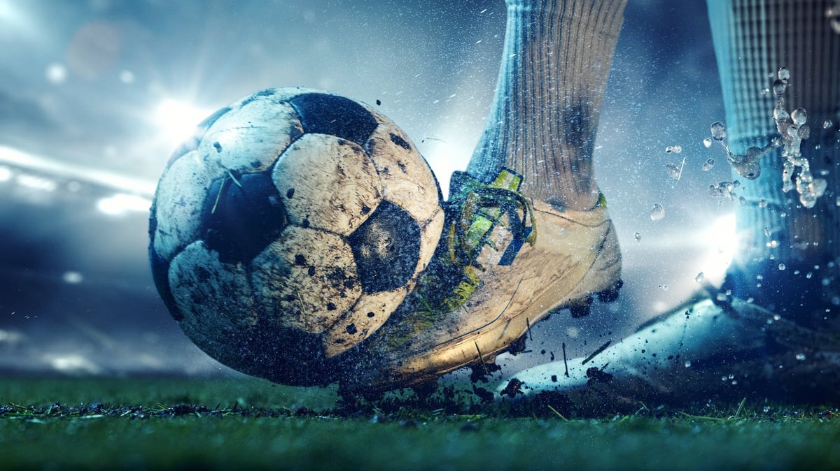 Soccer player celebrating goal in stadium